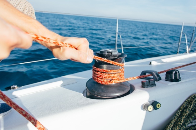 professional-sailor-yachtsman-tights-tensions-cable-wire-rope-mechanical-winch-sailboat-yacht_346278-331